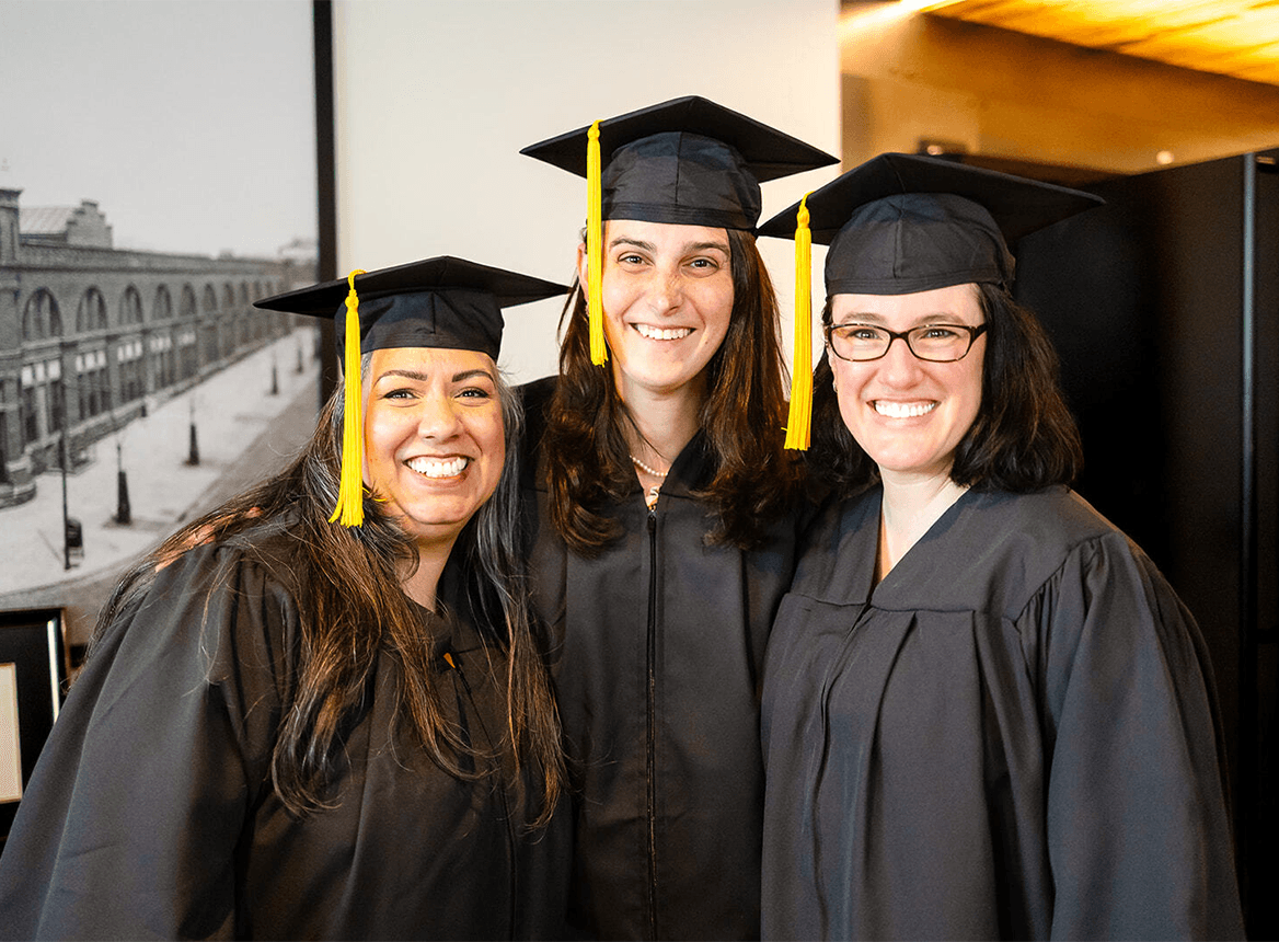 Three Women Graduates Smiling