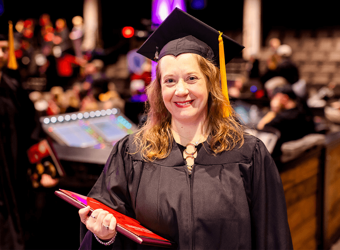 Graduate Smiling at Graduation Ceremony