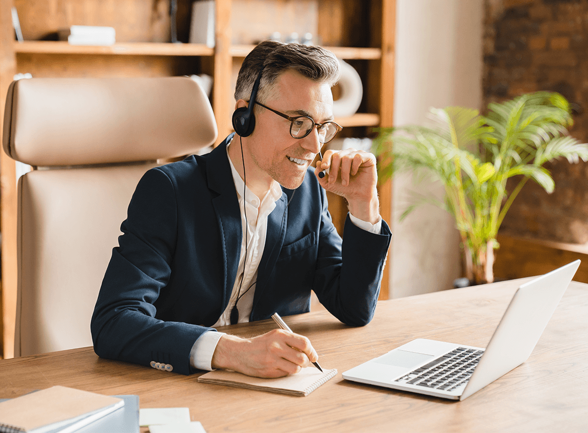Man at laptop on virtual meeting
