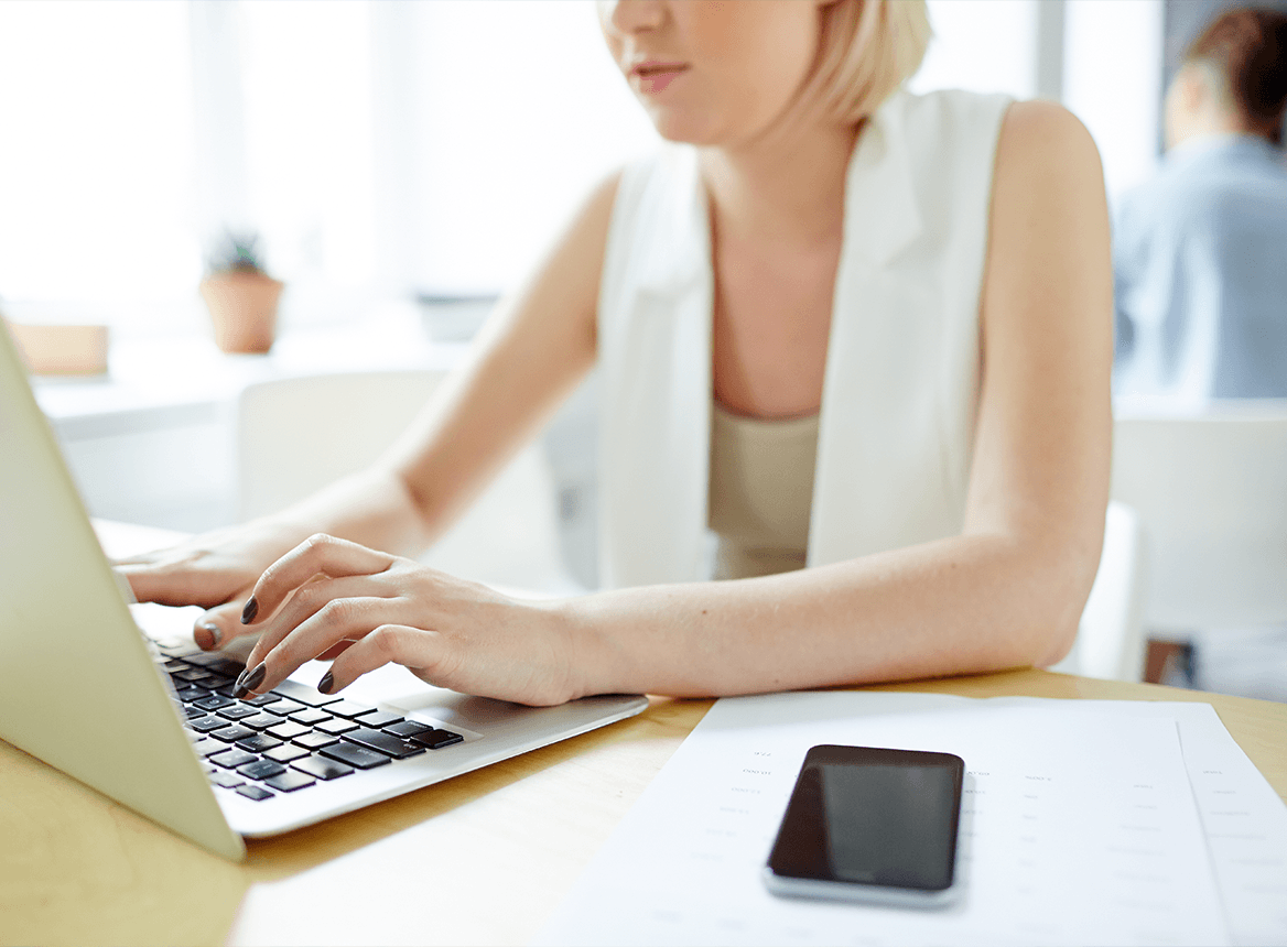 Blonde Woman in White Vest Using Laptop