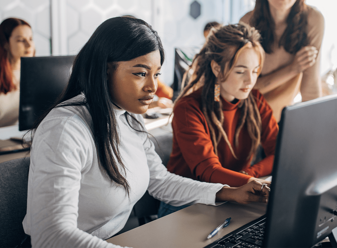 Two Women Working at a Laptop