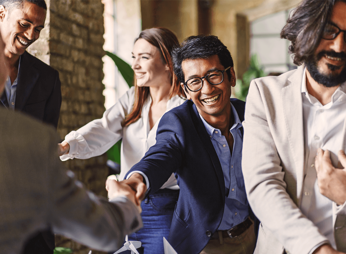 Business People Shaking Hands and Smiling