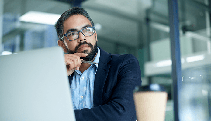 Man working at desk with laptop