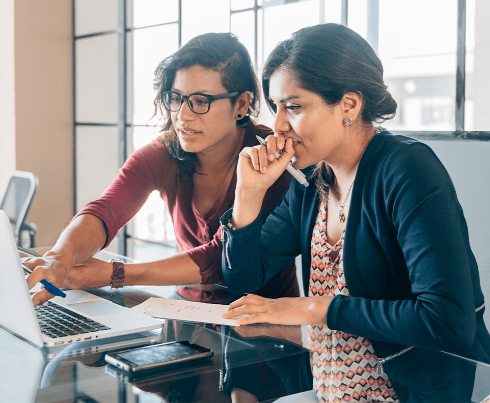 Two women studying on a laptop